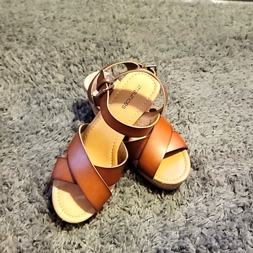 Strappy, open toe, heeled sandal.